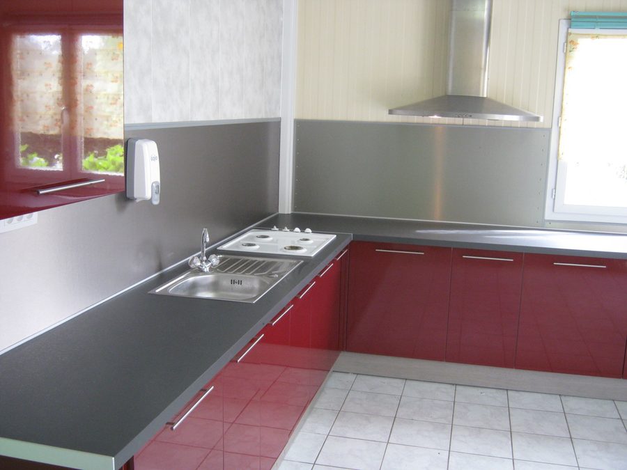 Red kitchen with stainless worktop