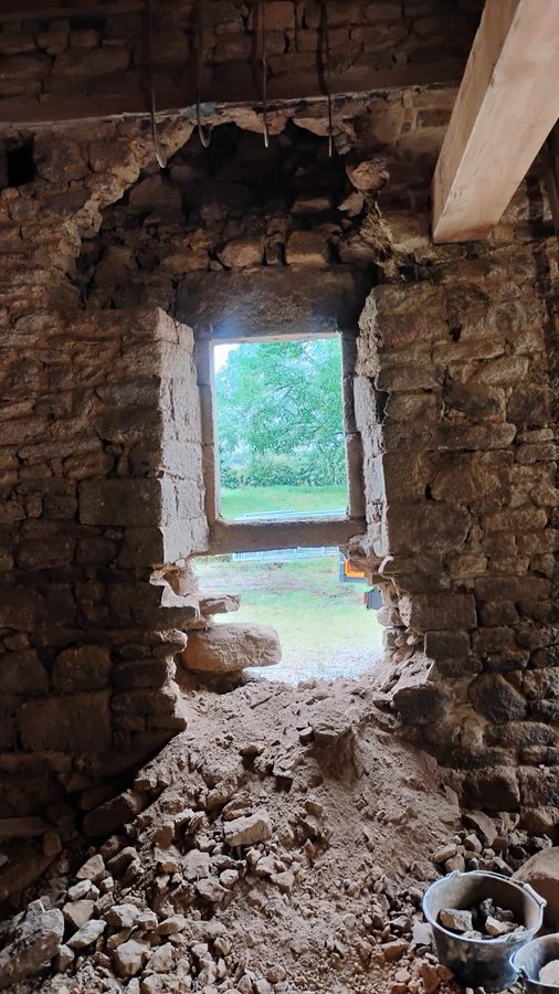Before: a small window in a thick stone wall