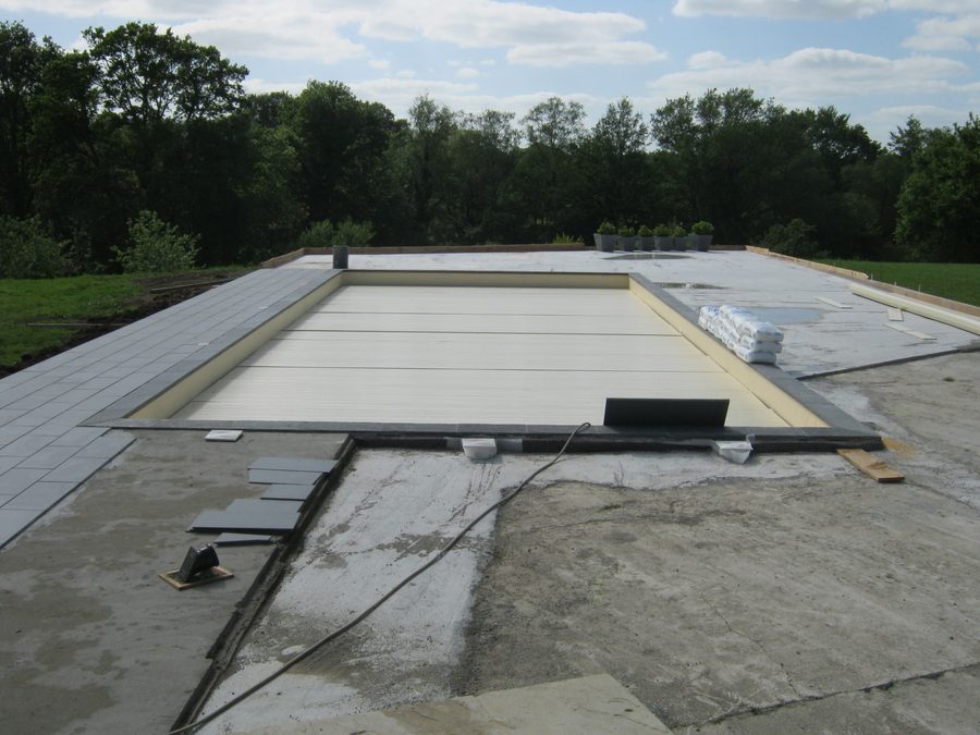Pool surround: before, the bare concrete slab