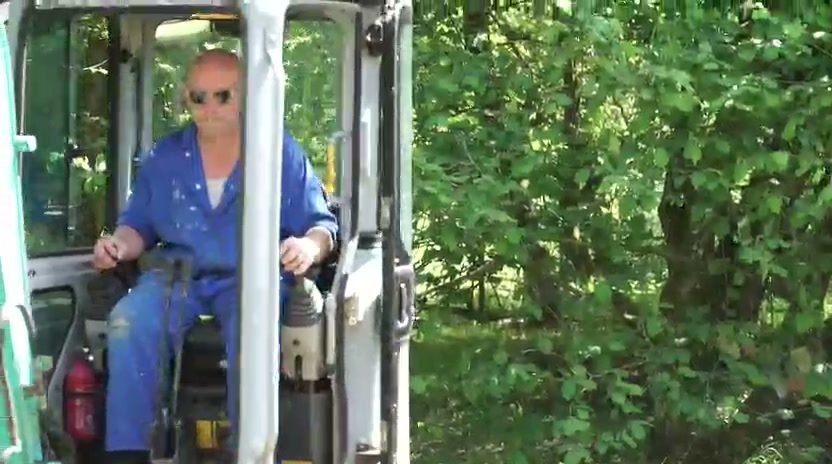 Lee at the controls of his digger.
